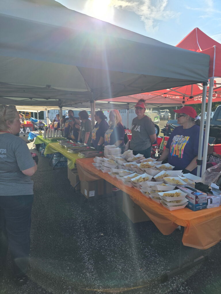 Hospitality volunteers serving up game-day snacks