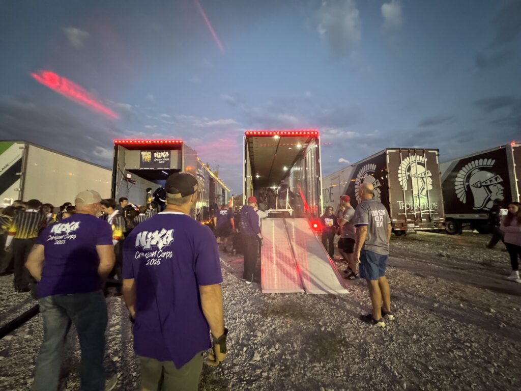 Crew volunteers unloading show props from the trailers